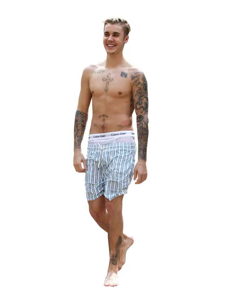 Shirtless Man with Tattoos Smiling