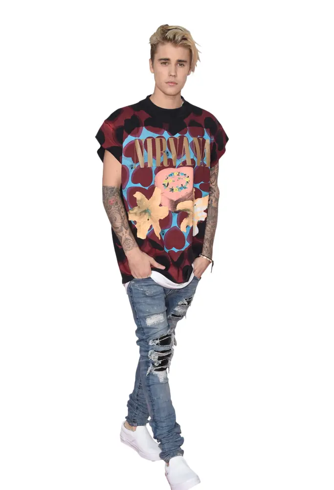 Person in Casual Outfit with Tattoos and Ripped Jeans