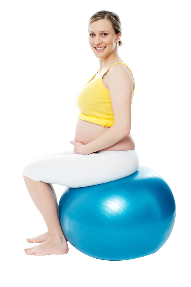 Pregnant Woman Sitting on Exercise Ball