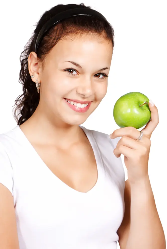 Girl Holding a Green Apple