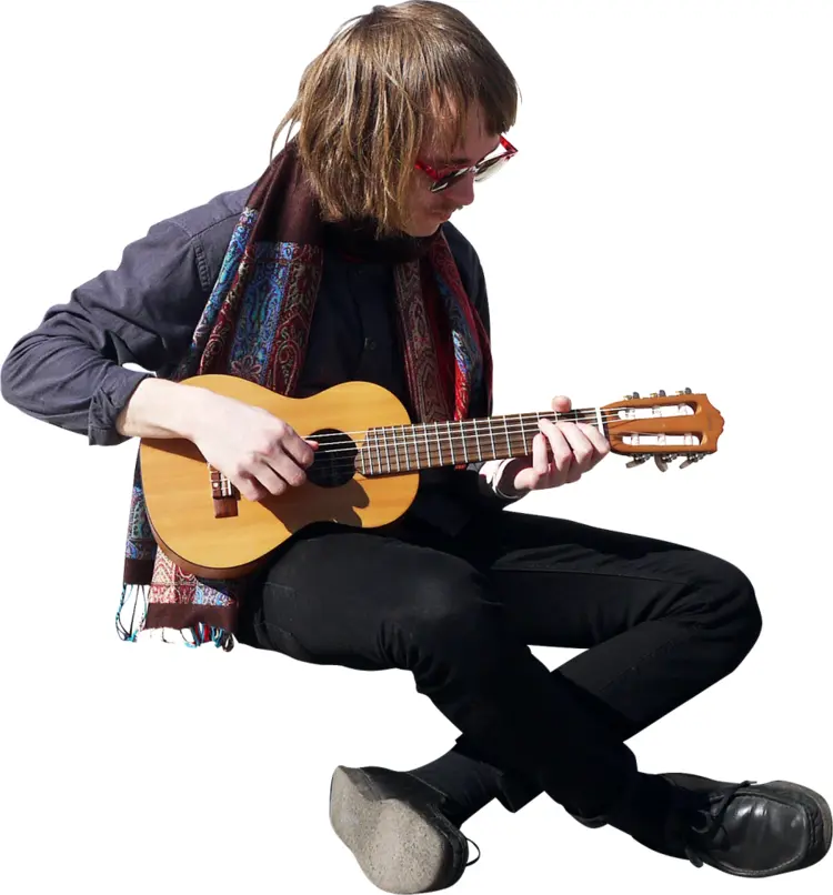 Guitarist Sitting and Playing