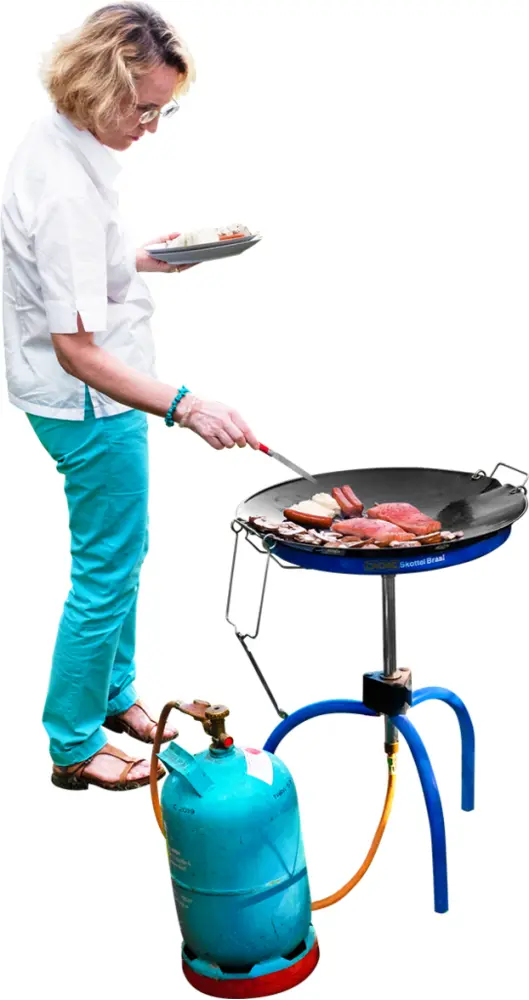 Woman Grilling Food Outdoors