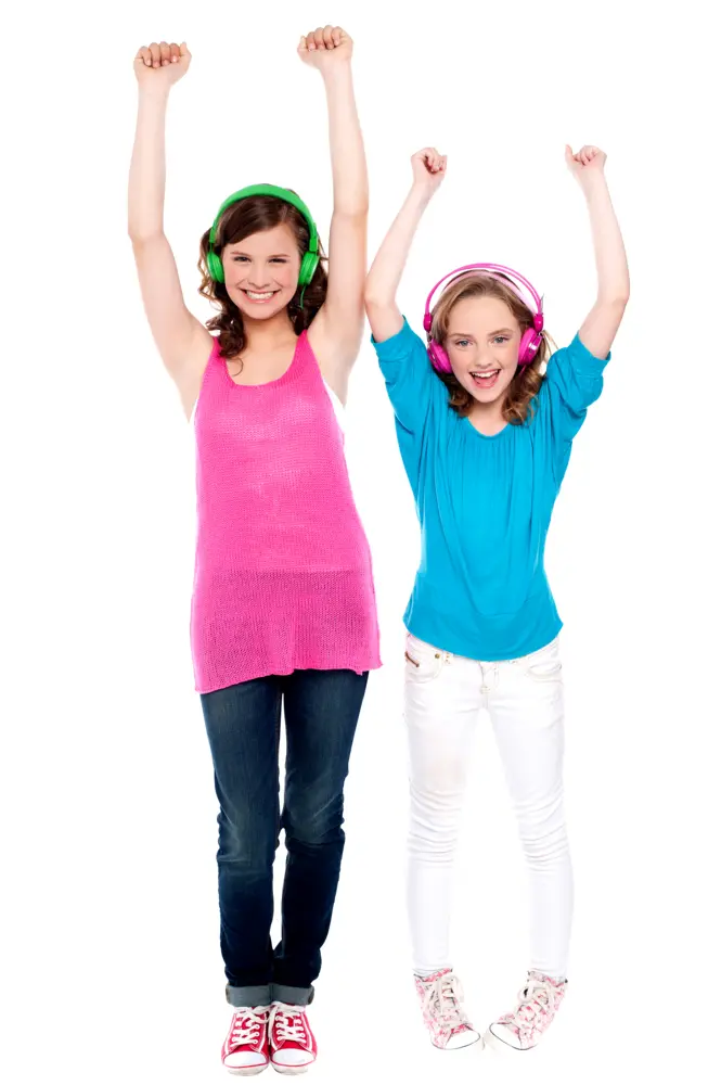 Two Girls Smiling and Standing with Headphones