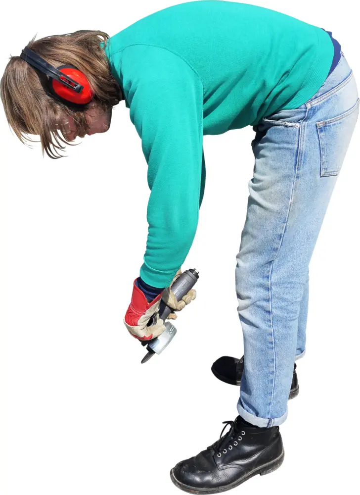 Person in Green Sweater Drilling