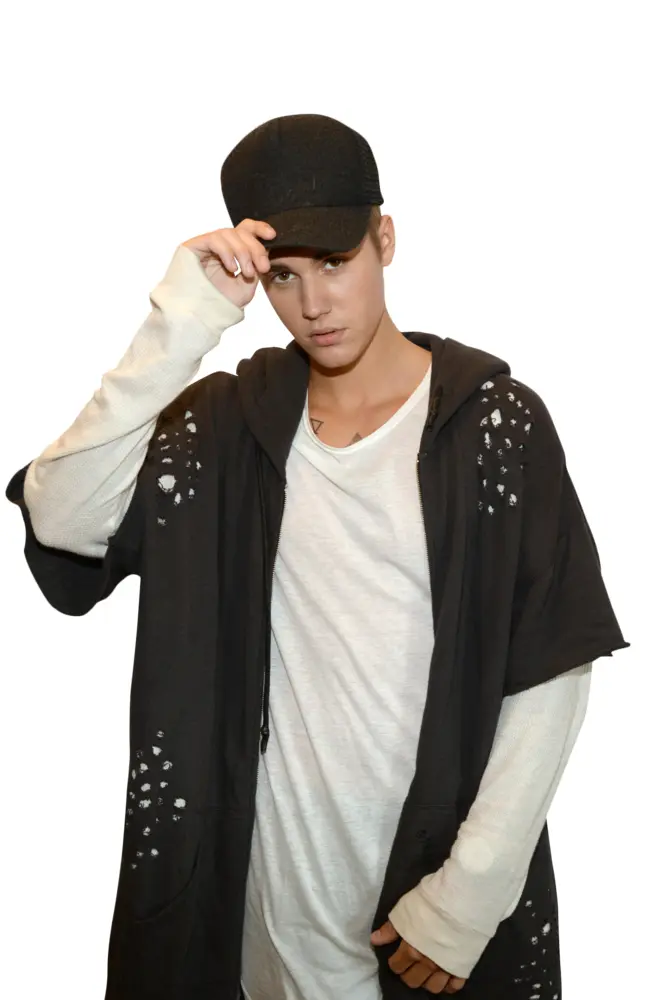 Person in Casual Black Cap and White Shirt