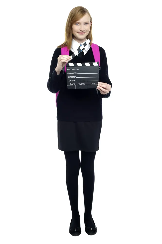 Girl in School Uniform Holding Clapperboard