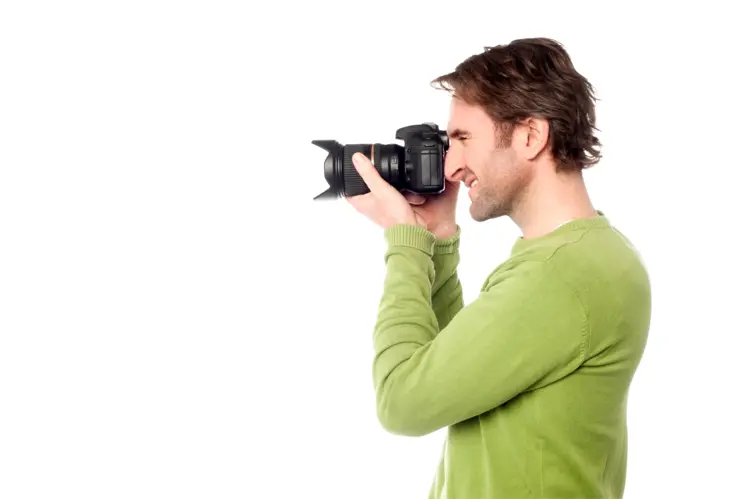 Photographer in Green Shirt Taking a Picture