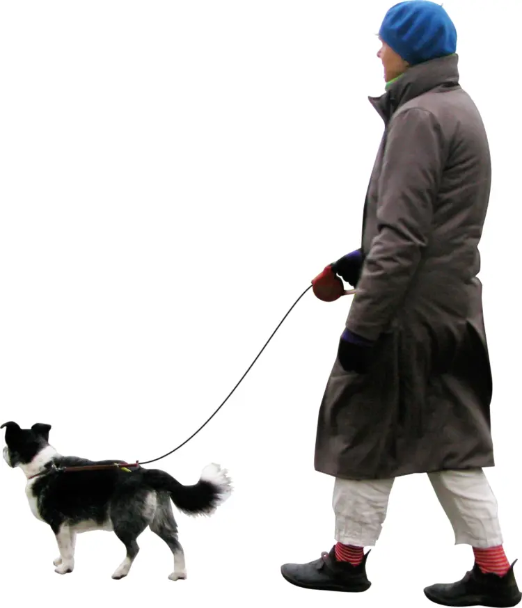 Man Walking Dog in Winter Clothing
