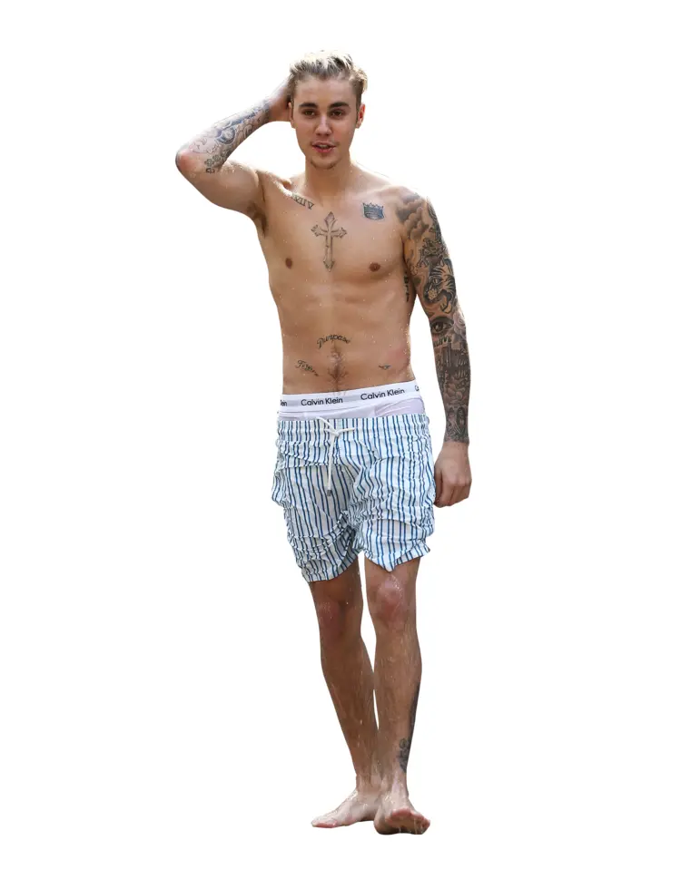 Shirtless Man with Tattoos in Shorts