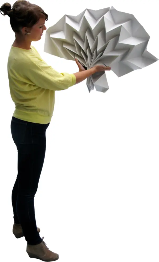 Woman Holding Large Folded White Paper