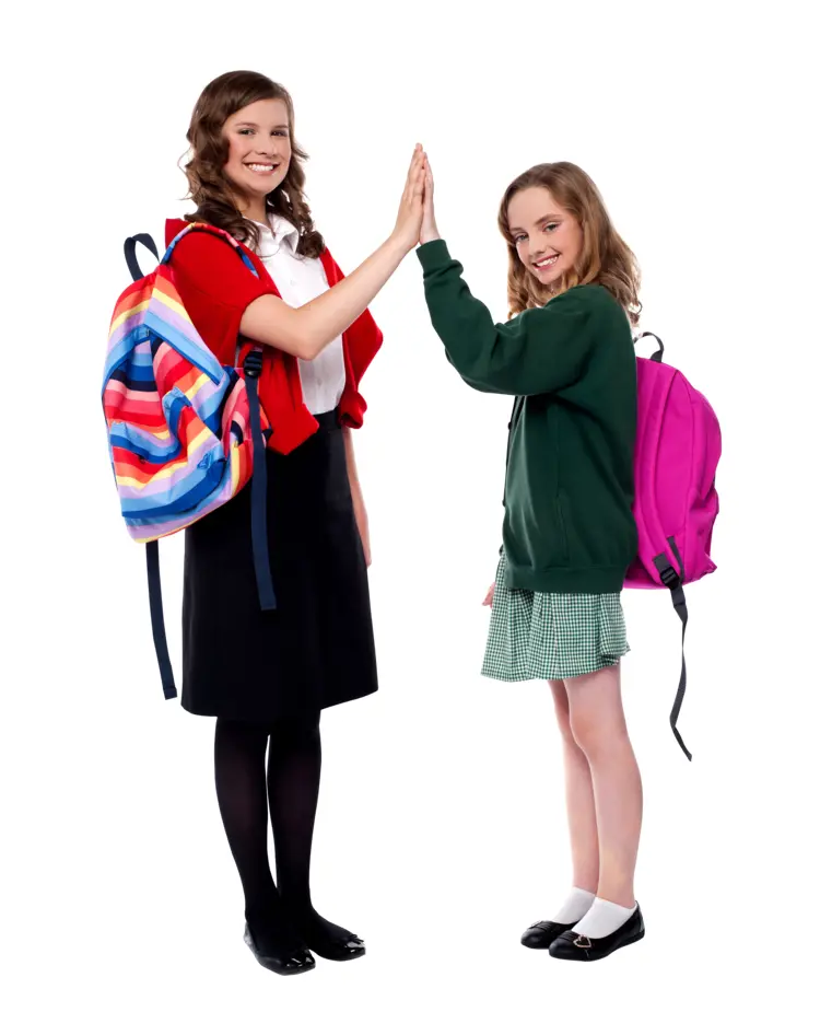 Students with Backpacks High Fiving