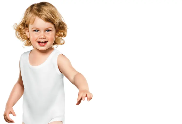 Smiling Toddler in White Outfit