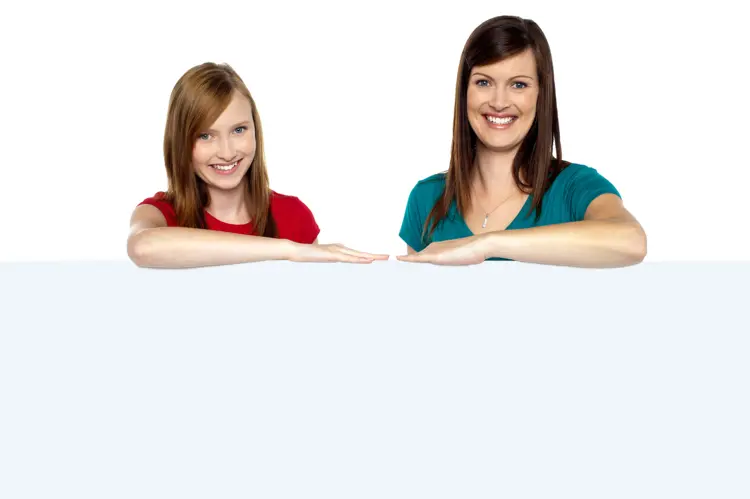 Two Women Holding Blank Sign