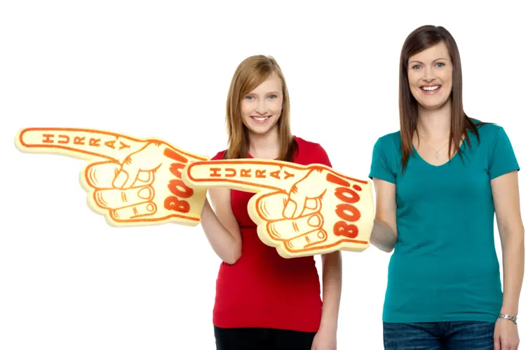 Two Women Pointing with Foam Fingers
