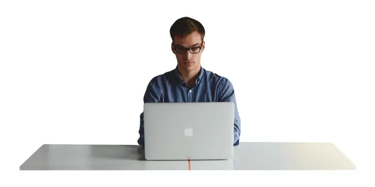 Focused Man Working on Laptop