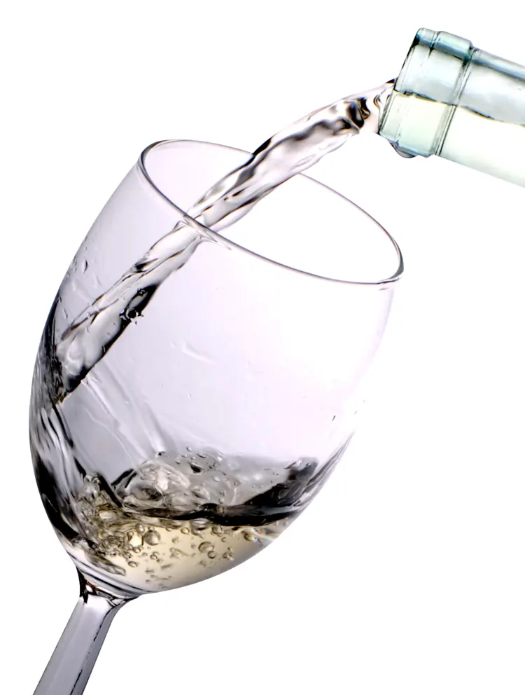 Pouring White Wine into a Glass