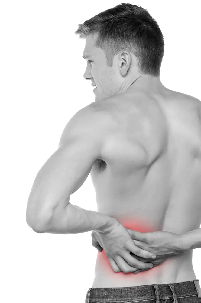 Man Holding Lower Back in Pain