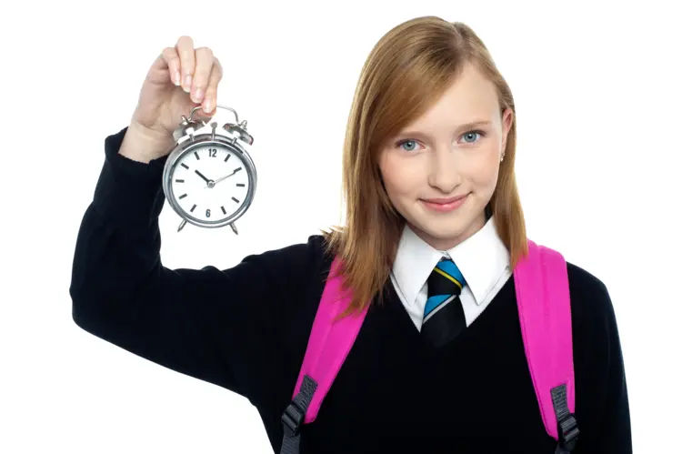 Girl Holding Alarm Clock