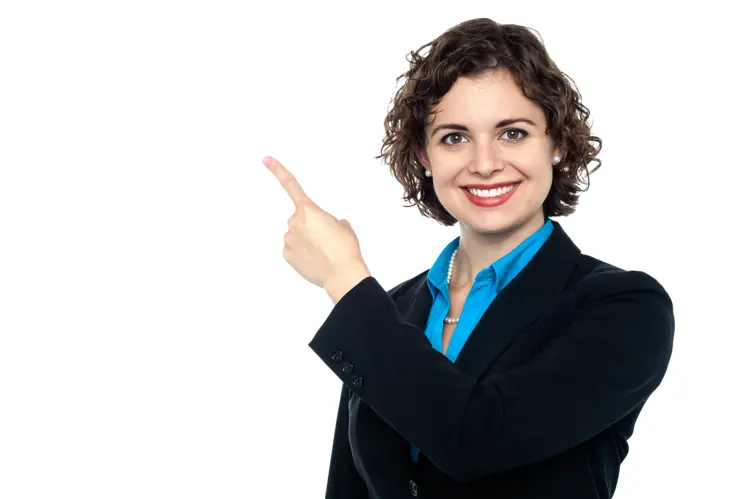Smiling Woman Pointing in Business Attire