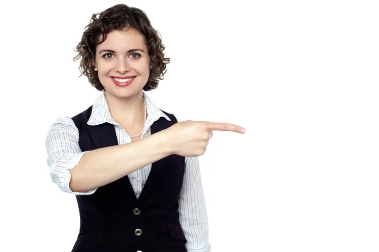 Smiling Woman Pointing to the Side in Vest