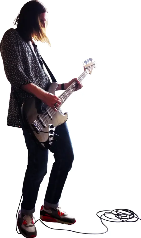Person Playing Bass Guitar