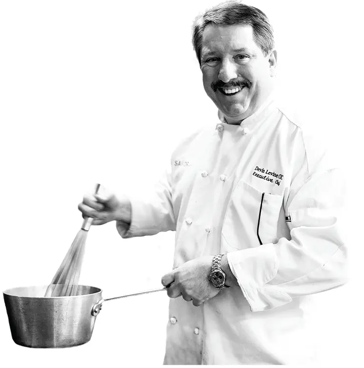 Smiling Chef Whisking in a Pot
