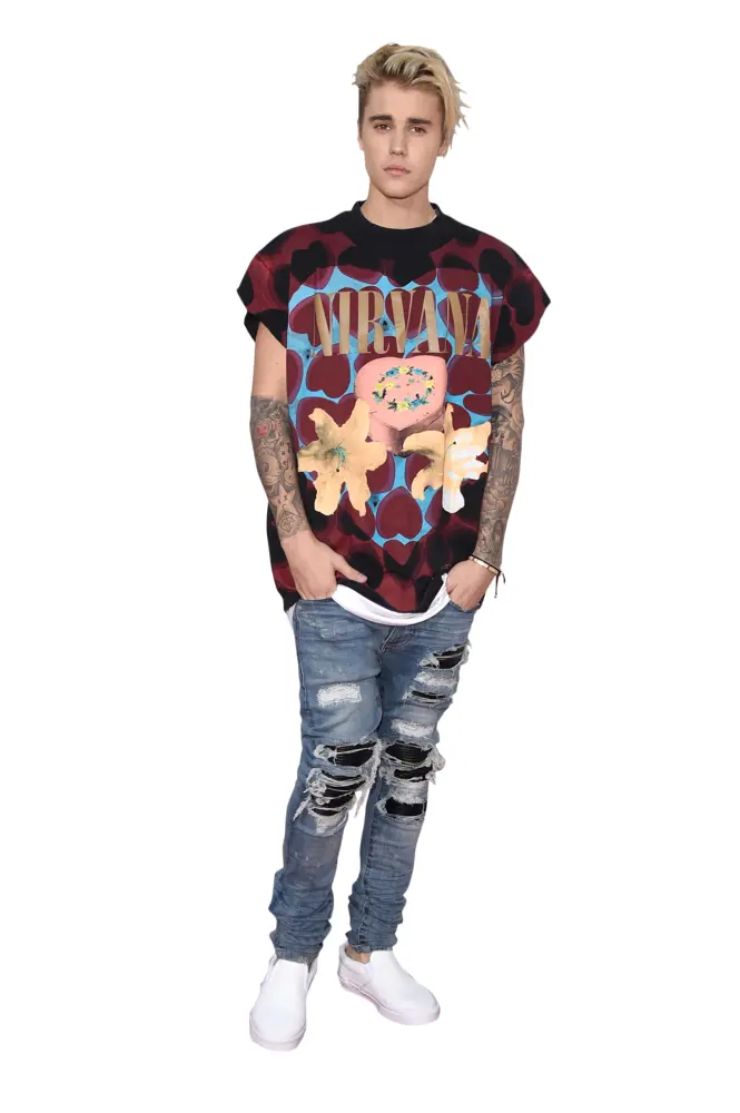 Person in Casual Outfit with Tattoos and Ripped Jeans