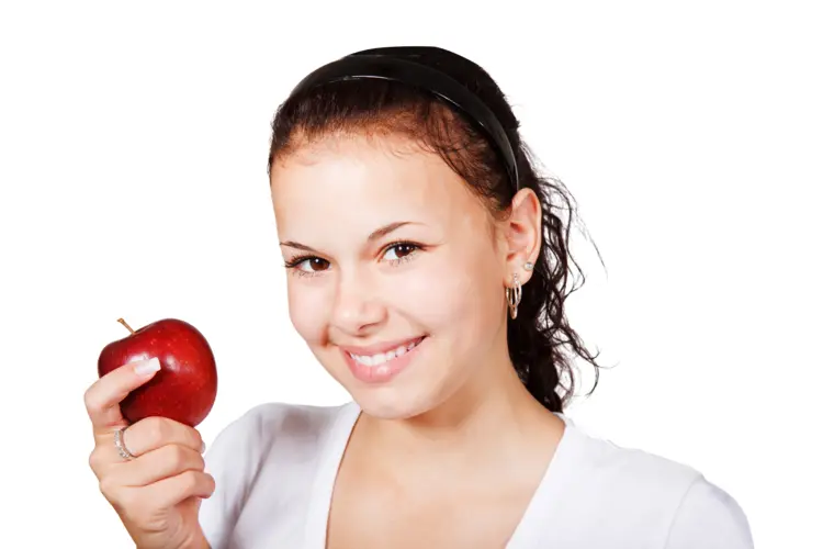 Smiling Woman Holding Red Apple
