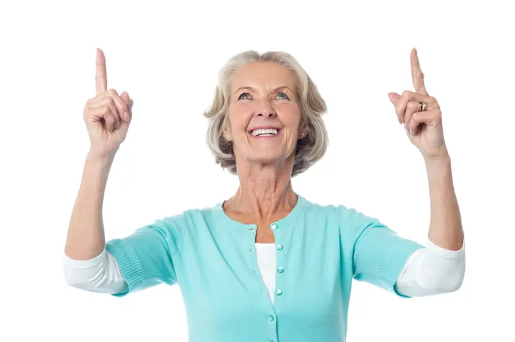 Smiling Elderly Woman Pointing Upwards