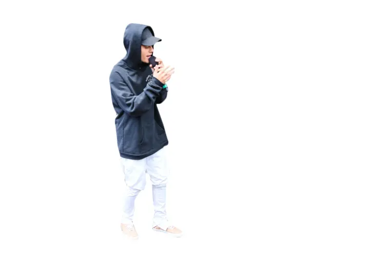 Person in Black Hoodie Speaking into Microphone