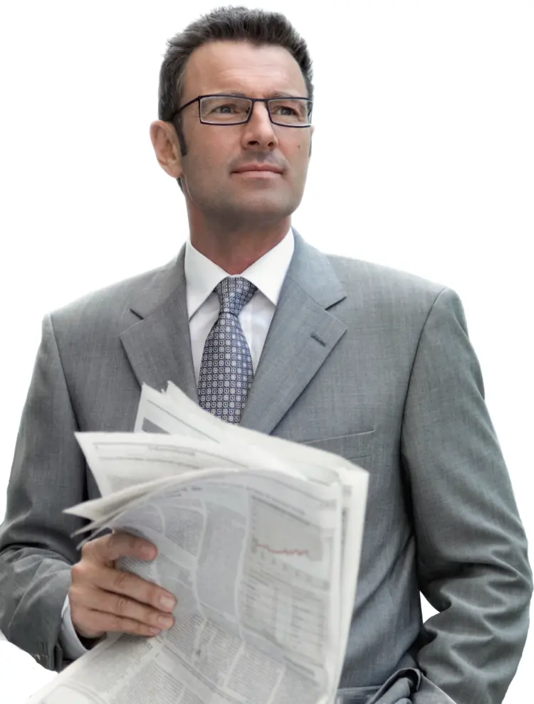 Businessman Reading Newspaper in Formal Suit