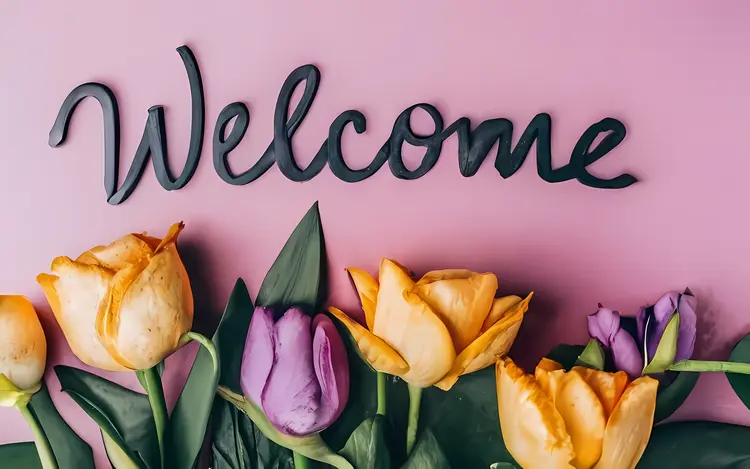 Welcome Text with Flowers on Pink Background