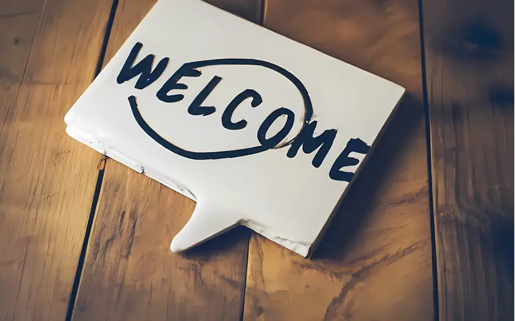 Welcome Sign on Wooden Background