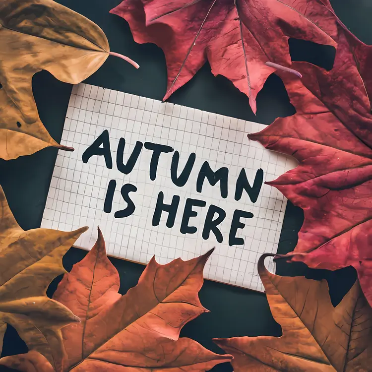 Autumn is Here Text with Leaves on Grid Paper