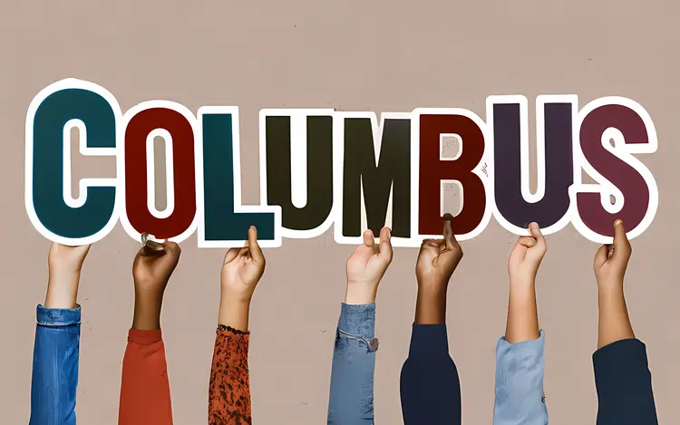 Hands Holding Columbus Letters