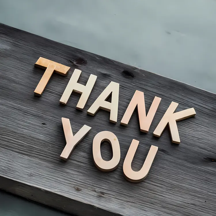 Simple Thank You Letters on Wooden Background