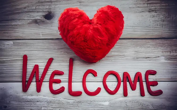 Welcome Text with Red Heart on Wooden Background