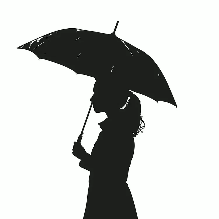 Silhouette of a Woman Holding an Umbrella